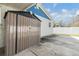 View of backyard shed on a concrete slab pad next to the home's exterior at 6303 Central Ave, New Port Richey, FL 34653