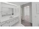 Bathroom showcasing a sink with storage and a walk-in closet for added convenience at 700 Starkey Rd # 914, Largo, FL 33771