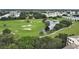 Scenic view of a well-manicured golf course with a tranquil pond and lush greenery at 700 Starkey Rd # 914, Largo, FL 33771