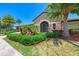 Beautiful clubhouse entrance with stone facade and manicured landscaping at 7115 Marsh View Ter, Bradenton, FL 34212