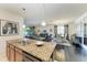 Kitchen view to living and dining area, showcasing an open floorplan at 7115 Marsh View Ter, Bradenton, FL 34212