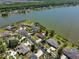 Stunning aerial showing home's idyllic setting on waterfront property with mature landscaping at 7609 Clair Wood Ct, Apollo Beach, FL 33572