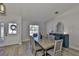 Dining room with a table for six, blue accent furniture, and natural light at 7609 Clair Wood Ct, Apollo Beach, FL 33572