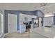 Modern kitchen featuring white cabinets, stainless steel appliances, stylish backsplash and a barn door at 7609 Clair Wood Ct, Apollo Beach, FL 33572