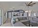 Comfortable living room seamlessly connects to a modern kitchen, creating an inviting and functional living space at 7609 Clair Wood Ct, Apollo Beach, FL 33572