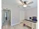 This home office has a ceiling fan, desk, and closet in a comfortably sized space at 7609 Clair Wood Ct, Apollo Beach, FL 33572