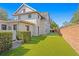 Beautiful backyard with a putting green and a brick wall providing privacy to the property at 1002 S Frankland Rd, Tampa, FL 33629