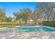 Expansive backyard features a pool, spa, golf course view and outdoor seating for entertaining at 1002 S Frankland Rd, Tampa, FL 33629
