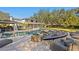 Expansive backyard features a pool, spa, fire pit, and outdoor seating for entertaining at 1002 S Frankland Rd, Tampa, FL 33629