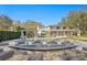 Resort-style backyard boasting pool, fire pit, outdoor kitchen, and meticulous landscaping at 1002 S Frankland Rd, Tampa, FL 33629
