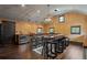Stylish bar area with chandelier lighting, counter seating, and dark wood floors at 1002 S Frankland Rd, Tampa, FL 33629