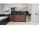 Modern bathroom with a bathtub, dark wood cabinets, and a large framed mirror at 1002 S Frankland Rd, Tampa, FL 33629