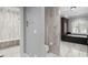 Elegant bathroom features marble floors, shower, tub and toilet at 1002 S Frankland Rd, Tampa, FL 33629