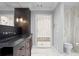 Stylish bathroom featuring dark wood cabinets, a walk-in shower, and modern fixtures at 1002 S Frankland Rd, Tampa, FL 33629