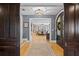 Grand foyer with hardwood floors, dark wood doors and arched entryway at 1002 S Frankland Rd, Tampa, FL 33629