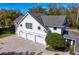 This home features an attached four-car garage and brick paved driveway at 1002 S Frankland Rd, Tampa, FL 33629