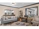 Bright and airy living room with a large mirror and open access to the kitchen area at 1002 S Frankland Rd, Tampa, FL 33629