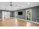 Bright and airy living room with hardwood floors and windows at 1002 S Frankland Rd, Tampa, FL 33629