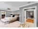 Elegant main bedroom featuring a ceiling fan and an en-suite bathroom at 1002 S Frankland Rd, Tampa, FL 33629