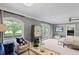 Bright main bedroom featuring a large window with a view and an en-suite bathroom at 1002 S Frankland Rd, Tampa, FL 33629