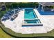 Aerial view of a luxurious pool and spa with an outdoor seating and dining area at 1002 S Frankland Rd, Tampa, FL 33629