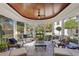 Spacious outdoor porch with comfortable seating, columns, and views of the yard at 1002 S Frankland Rd, Tampa, FL 33629