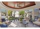 Inviting outdoor porch featuring comfortable seating and a stylish ceiling fan at 1002 S Frankland Rd, Tampa, FL 33629