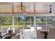 Bright and airy sunroom with beautiful backyard view, vaulted wood ceilings and ceiling fans at 1002 S Frankland Rd, Tampa, FL 33629