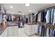 Large walk-in closet has custom built-in shelving and center islands at 1002 S Frankland Rd, Tampa, FL 33629
