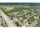 Aerial view of residential neighborhood showcasing community and proximity to a main thoroughfare at 105 Country Villas Dr, Safety Harbor, FL 34695