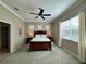 Comfortable bedroom with a ceiling fan and bright natural light at 11610 Griffith Park Ter, Bradenton, FL 34211