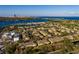 Wide aerial view of the community showcasing proximity to the water and city at 122 Coquina Bay Dr, St Petersburg, FL 33705