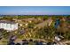Street view of the community featuring manicured landscaping and well-maintained buildings at 122 Coquina Bay Dr, St Petersburg, FL 33705