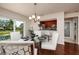 Chic dining area featuring a glass table, white chairs, and views to the outside, perfect for entertaining and comfort at 122 Coquina Bay Dr, St Petersburg, FL 33705