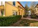 Inviting exterior with meticulous landscaping, creating a warm and welcoming ambiance that enhances curb appeal and charm at 122 Coquina Bay Dr, St Petersburg, FL 33705