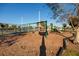 Playground in the community with a swing set and slide, and tennis court at 122 Coquina Bay Dr, St Petersburg, FL 33705