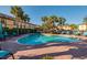 Community pool with lots of chairs and palm trees surrounding the area at 122 Coquina Bay Dr, St Petersburg, FL 33705
