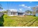 A view of the backyard with a boat and other outdoor accessories, illustrating outdoor potential at 130 81St Ne Ave, St Petersburg, FL 33701