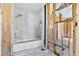 A bathroom features a modern bathtub, shower, and tile details, ready for customization at 130 81St Ne Ave, St Petersburg, FL 33701