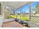 Enclosed porch featuring brick flooring and golf equipment at 130 81St Ne Ave, St Petersburg, FL 33701