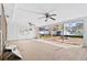 Large room with sliding windows and doors showing potential as a sunroom, ready for personalization at 130 81St Ne Ave, St Petersburg, FL 33701