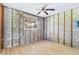 Spacious room with new wood floors, exposed framing and lots of natural light from a large window at 130 81St Ne Ave, St Petersburg, FL 33701