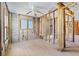 Spacious room with new wood floors, exposed framing and lots of natural light from a large window at 130 81St Ne Ave, St Petersburg, FL 33701