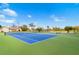 Exterior shot of two tennis courts with well maintained paint, nets, and clear skies at 130 81St Ne Ave, St Petersburg, FL 33701