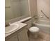 Bathroom with tile floor, single sink vanity, and tub with shower at 1308 Pine Ridge E Cir # E3, Tarpon Springs, FL 34688