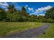 Winding path through the landscaped grounds at 1308 Pine Ridge E Cir # E3, Tarpon Springs, FL 34688