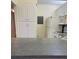 Eat-in kitchen features white cabinets and appliances at 1308 Pine Ridge E Cir # E3, Tarpon Springs, FL 34688
