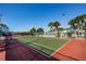 Enjoy a game of tennis on this well-maintained community court surrounded by lush landscaping at 1308 Pine Ridge E Cir # E3, Tarpon Springs, FL 34688