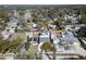 An aerial view of the property showing the house, driveway, and backyard at 1413 Wisconsin Ave, Palm Harbor, FL 34683