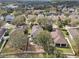 Aerial view of a home with a fenced yard and a private outdoor patio seating area at 15701 Greyrock Dr, Spring Hill, FL 34610